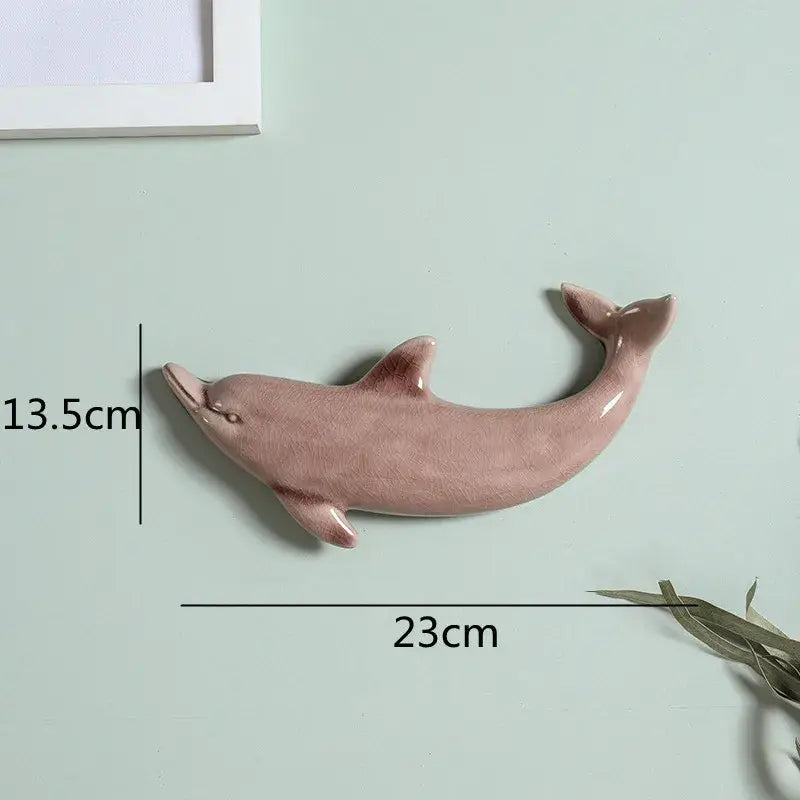 Smooth matte-finished pink ceramic dolphin fish ocean wall decoration for children’s room by decorbites dolphin fish