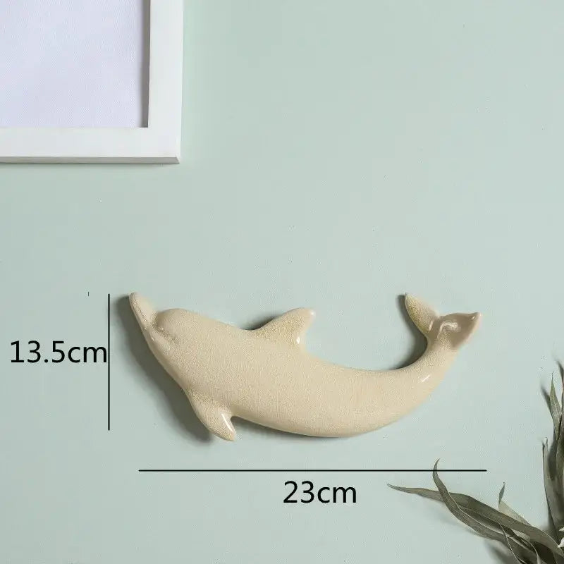 Cream-colored ceramic dolphin fish ocean wall decoration 23cm long 13.5cm tall for children’s room decorbites wall decoration