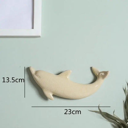 Cream-colored ceramic dolphin fish ocean wall decoration 23cm long 13.5cm tall for children’s room decorbites wall decoration