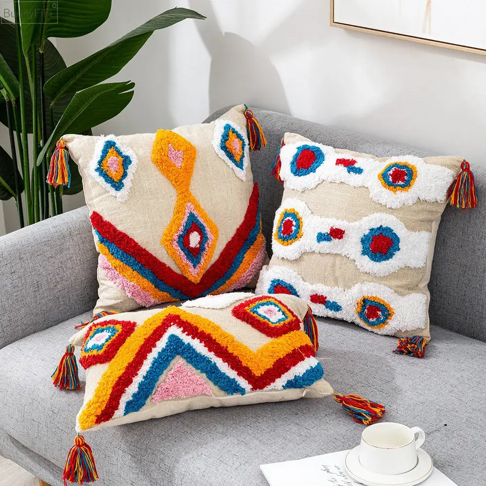 Three colorful textured throw pillow covers with geometric patterns and decorbites boho tassel macrame design