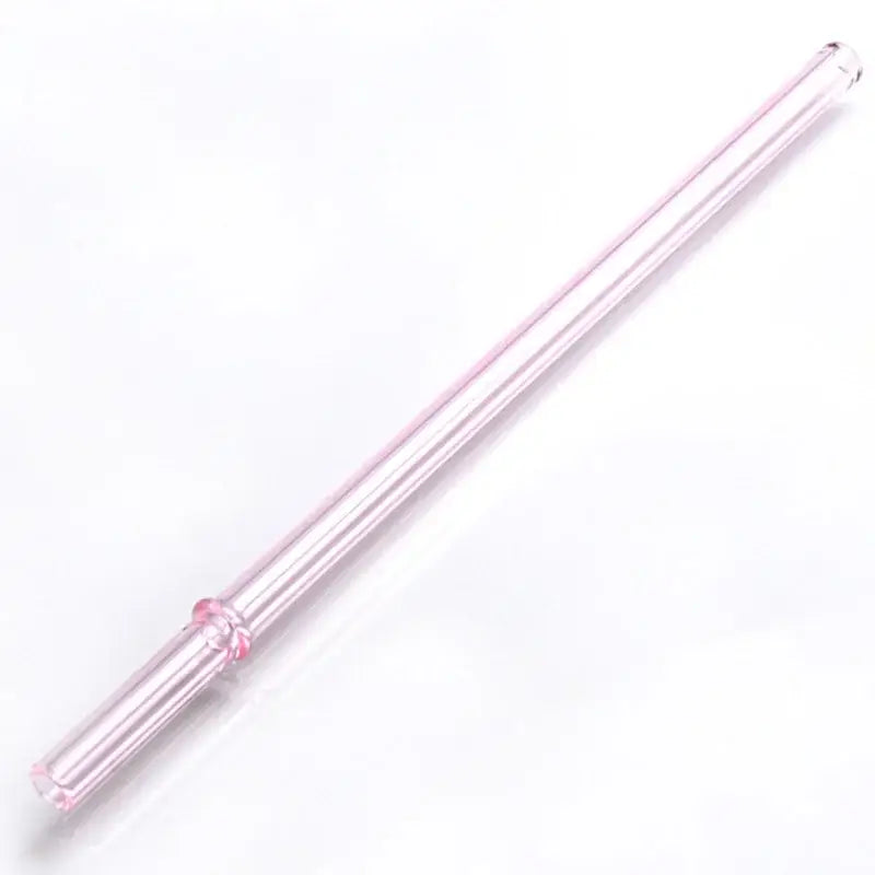 Translucent pink decorbites glass bent straw with floral design near bottom in colorful reusable kitchen straw set