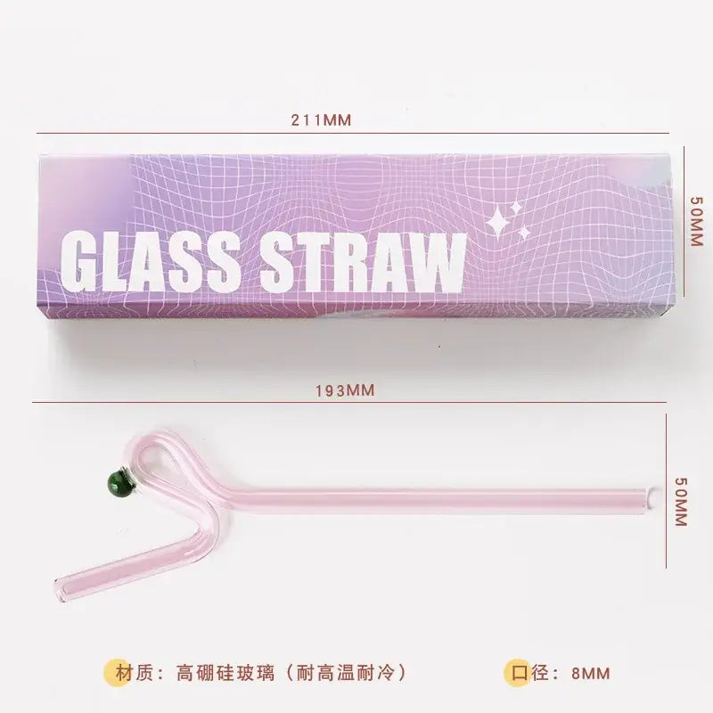 Translucent pink glass flower handle stir bar with curved design and small green bead for kitchen cocktail use