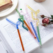 Colorful glass flower handle stir bar and cocktail straw with transparent twisted glass and small green caps