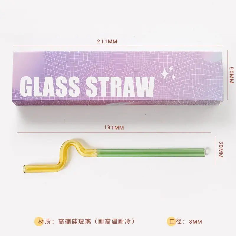 Curved glass flower handle stir bar with yellow tapered end green middle and white plastic loop for cocktail use