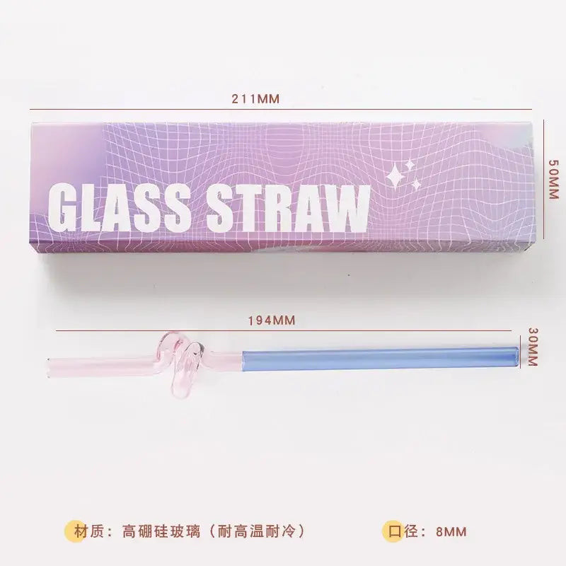 A delicate two-toned glass flower handle stir bar with pink and blue gradient and twisted design top for kitchen use