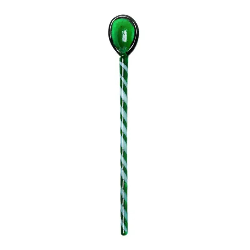 A translucent green stirring spoon with a twisted light blue and green pattern by decorbites colorful glass