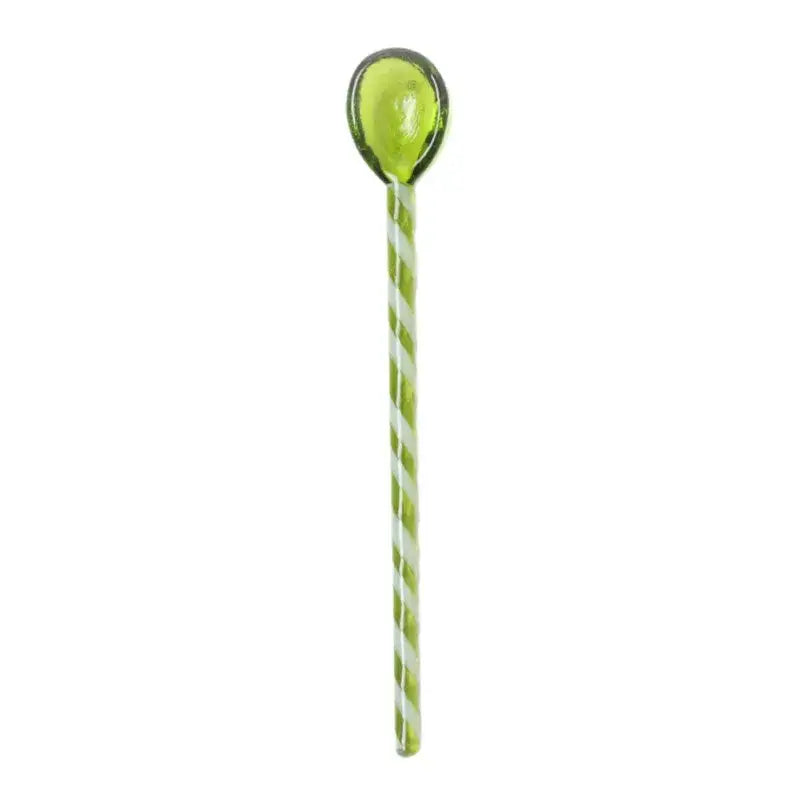 A colorful glass stirring spoon with a translucent lime green bowl and white light green striped handle from decorbites colorful glass set