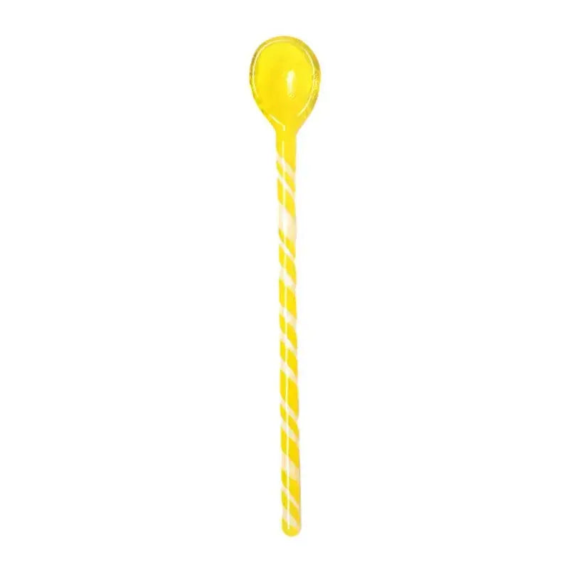 A translucent yellow colorful glass stirring spoon with candy stripes and spiral pattern for kitchen and dining decorbites colorful glass