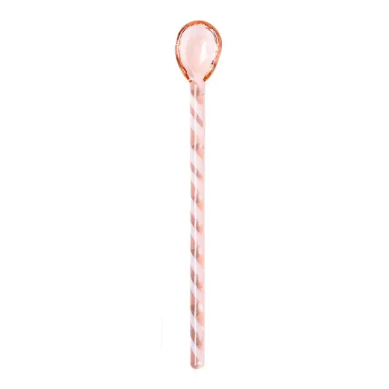 A translucent rose gold stirring spoon with twisted stripes and smooth handle from decorbites colorful glass set