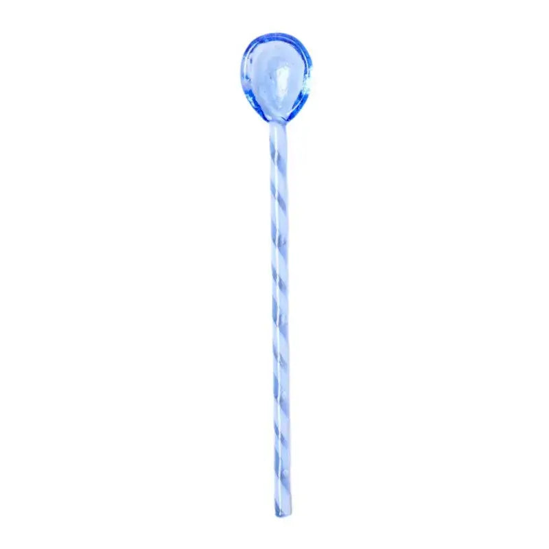 A translucent blue colorful glass stirring spoon with a twisted handle and oval bowl for kitchen use decorbites colorful glass