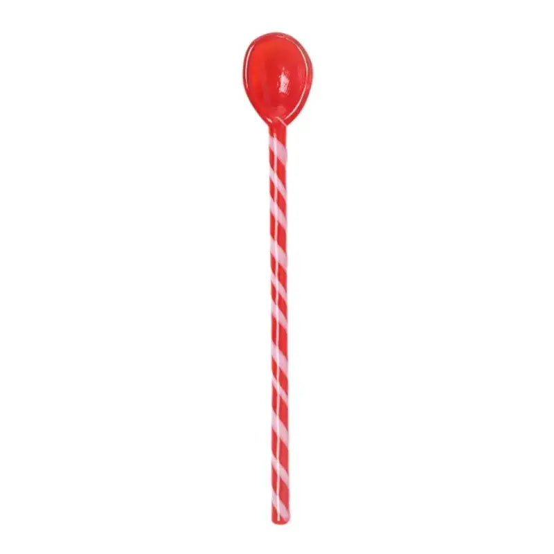 Glossy red and white candy cane striped colorful glass stirring spoon with a smooth bowl for kitchen and dining use