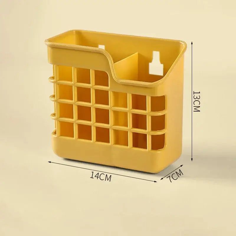 A bright yellow plastic decorbites kitchen cutlery storage holder with a grid pattern and integrated bottle cutout