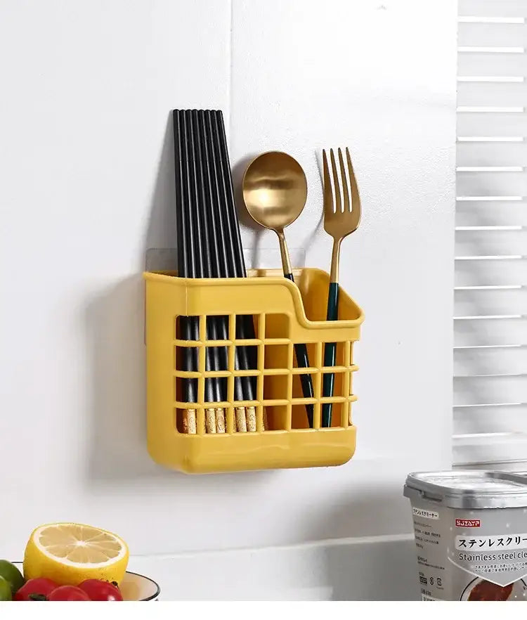 Yellow plastic wall-mounted decorbites kitchen cutlery holder with black chopsticks and gold spoon and fork for storage