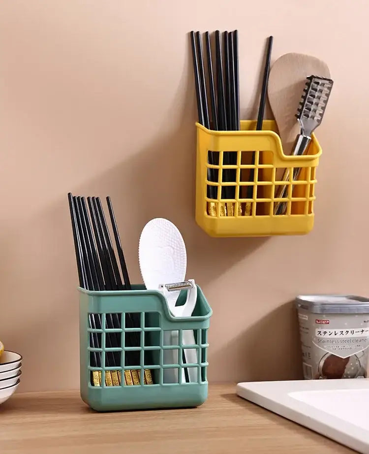 Yellow plastic wall-mounted kitchen cutlery storage holder with grid pattern and slots for chopsticks spoons and spatulas decorbites kitchen cutlery