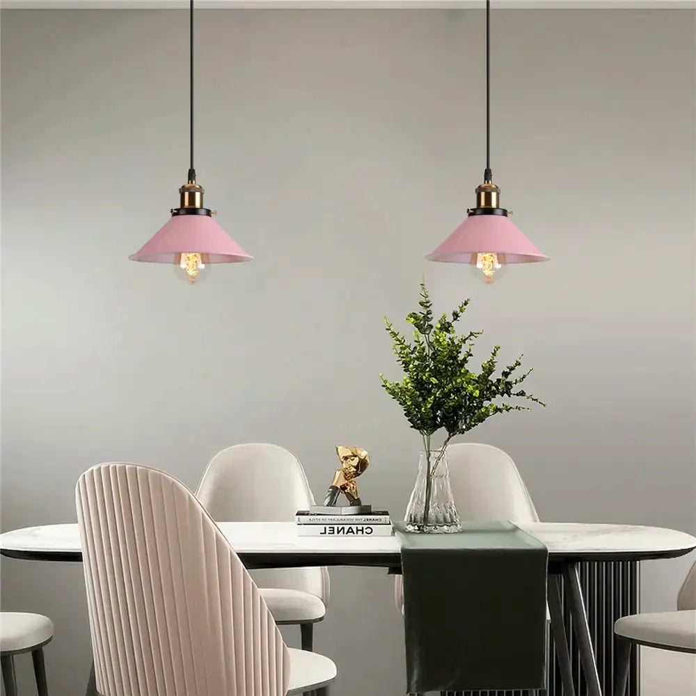 Pink conical decorbites colorful industrial loft pendant light with brass finish hanging above dining table