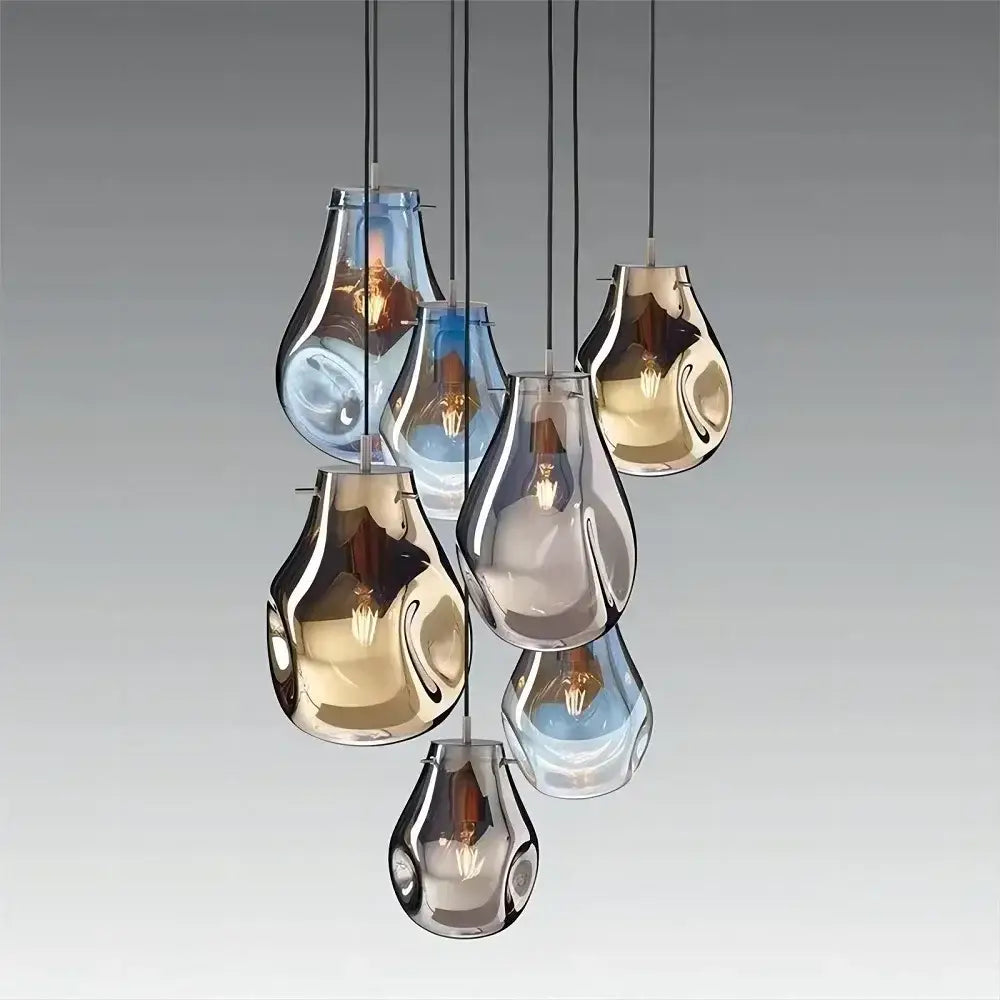 Colorful modern glass chandelier with seven teardrop glass shades in gold and blue for dining room decorbites colorful modern