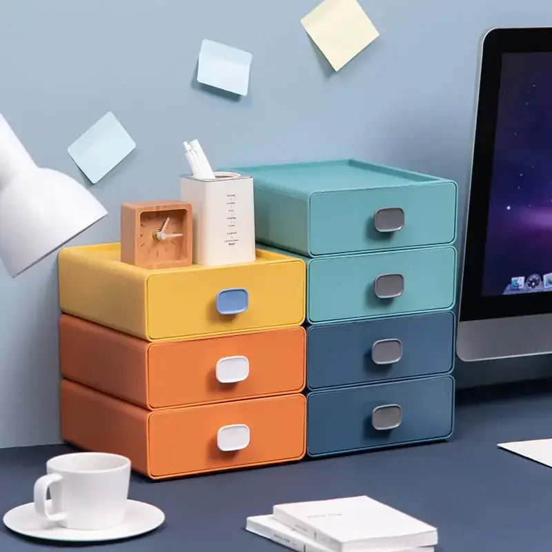 Colorful multi drawer desktop cosmetic storage box with stacked multi-colored plastic organizers and matte rectangular handles