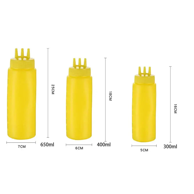 Three yellow plastic decorbites condiment squeeze bottles with three-pronged caps in 300ml, 400ml, and 650ml sizes