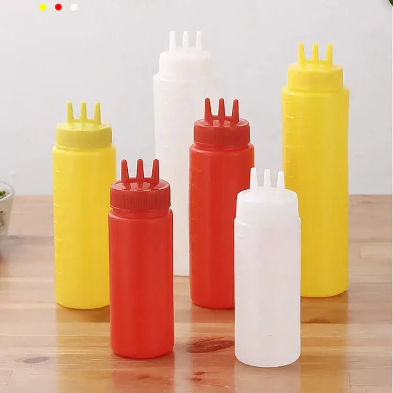Colorful plastic condiment squeeze bottle set with multi spout caps in yellow red and white for kitchen use decorbites condiment squeeze