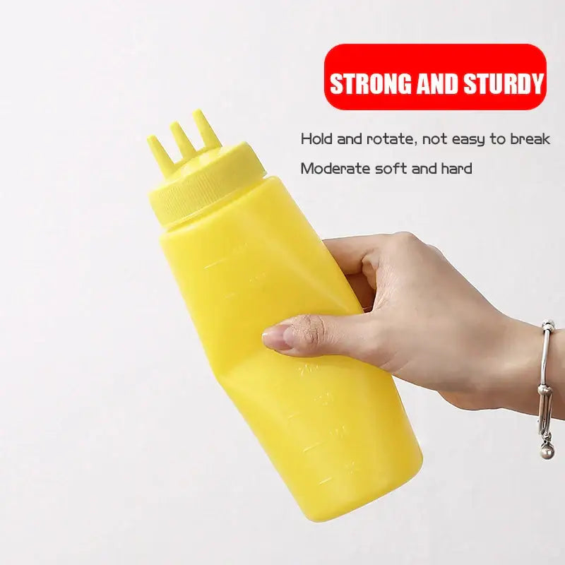 Yellow plastic decorbites condiment squeeze bottle with yellow cap and three nozzles from multi prong squeeze bottle set
