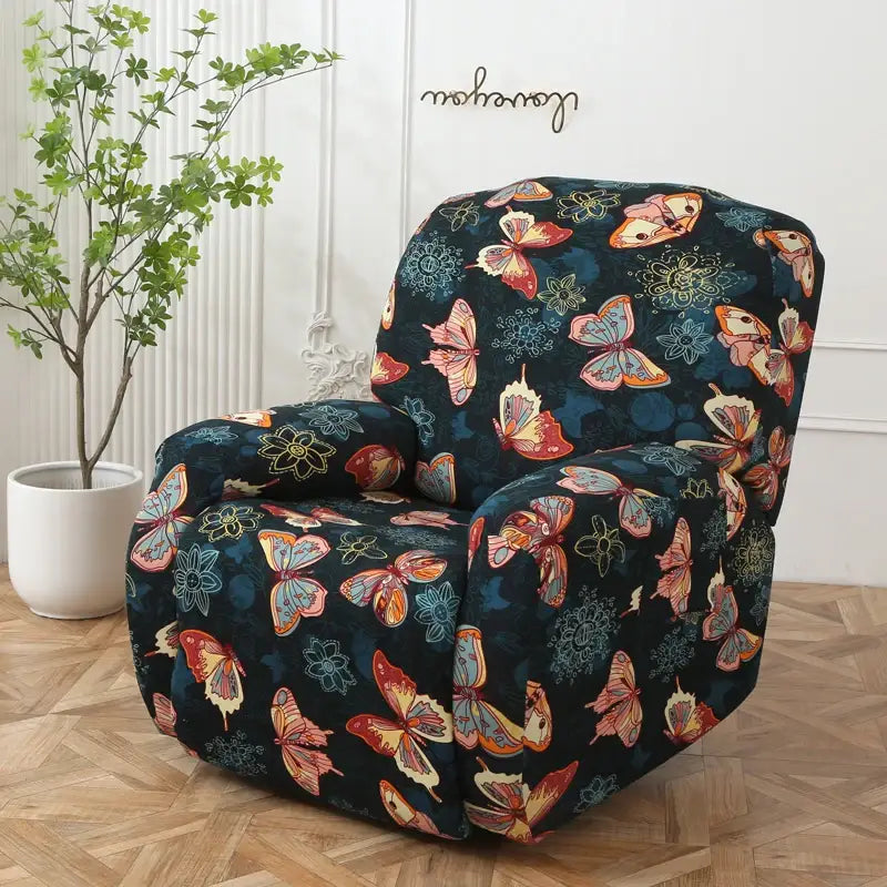 A cozy dark blue recliner covered with a colorful patchwork elastic sofa cover featuring butterflies and floral patterns