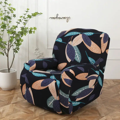 Black armchair with colorful patchwork elastic sofa cover featuring teal tan and navy blue leaf pattern protector