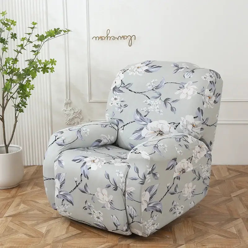 A light gray recliner chair with a colorful patchwork elastic floral sofa cover featuring white blossoms and green leaves
