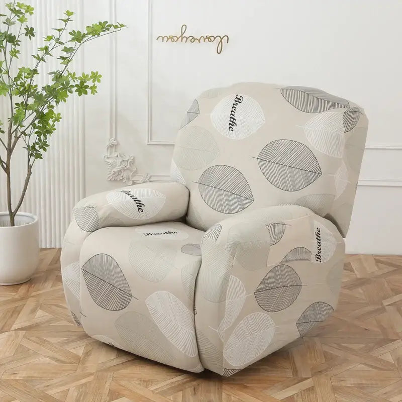 Beige stretchy recliner sofa cover with gray and white leaf motifs and breathe script for living room protection