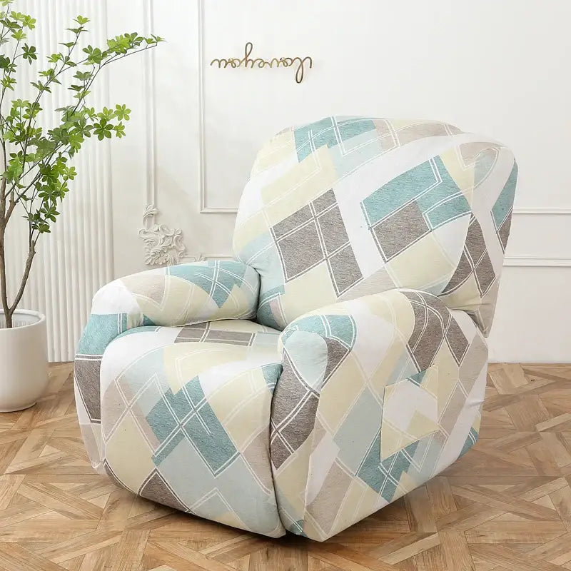 A cozy recliner chair covered with a colorful patchwork elastic sofa cover in pastel teal beige and gray tones
