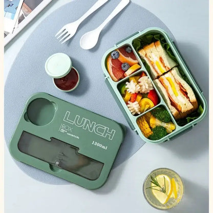 Mint green plastic lunch box set with clear lid and compartments for sandwiches vegetables and fruit storage