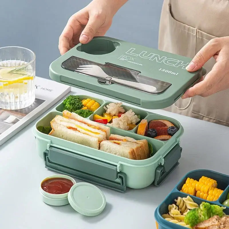 Mint green plastic lunch box set with clear lid compartment holding silverware and 1800ml capacity printed on top