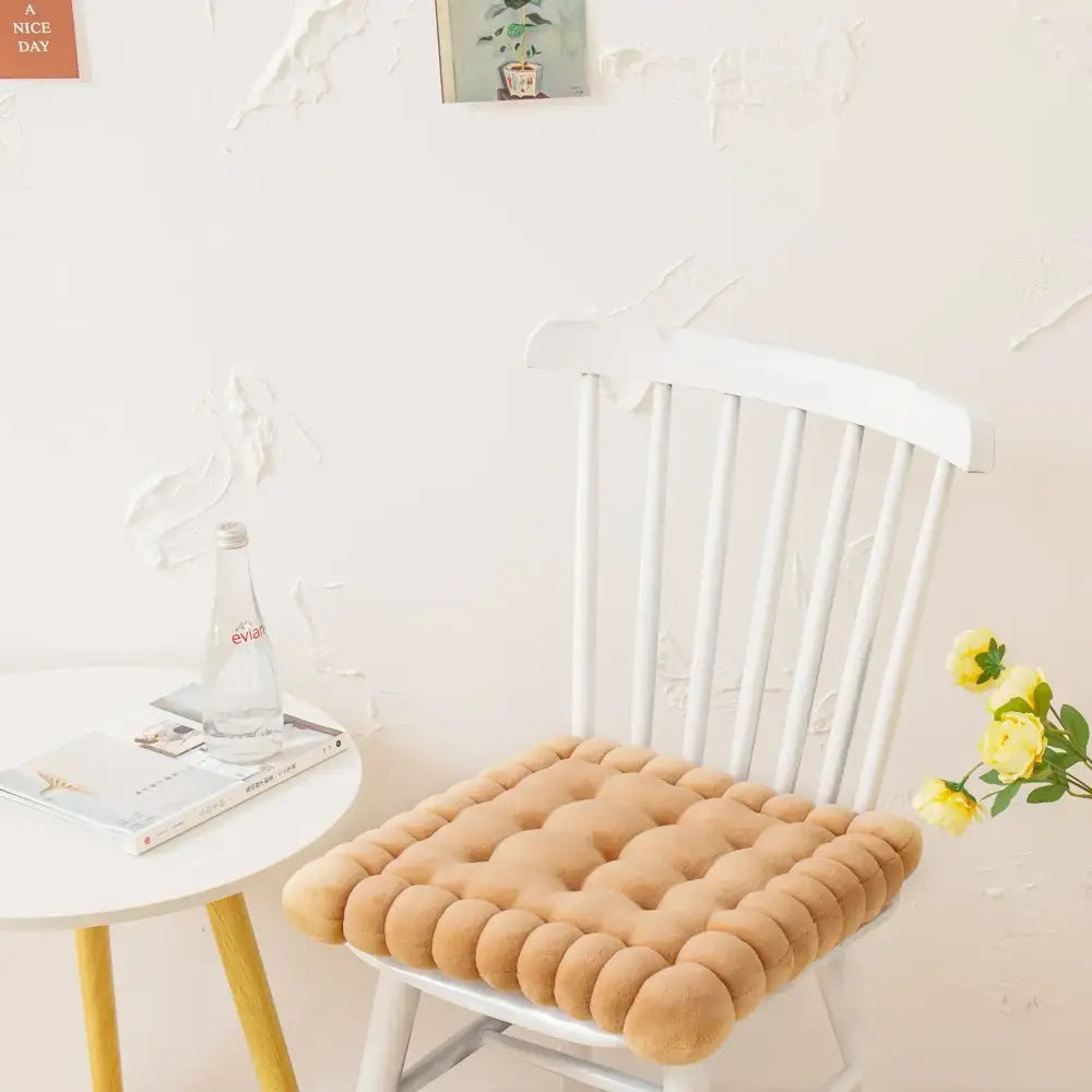 Beige tufted cookie biscuit cushion with soft plush texture and rounded button detailing for living room use