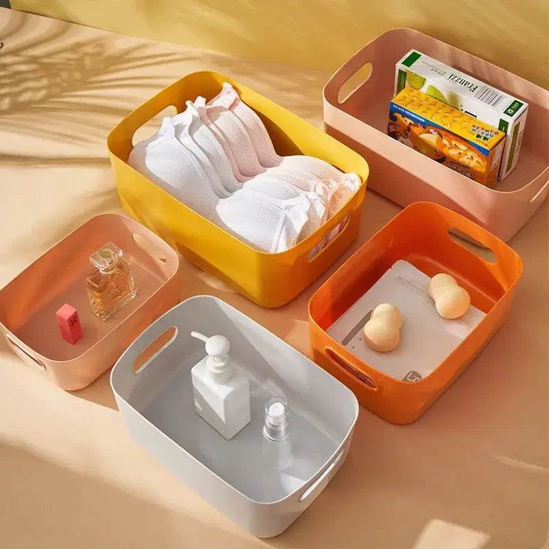 Set of colorful plastic decorbites kitchenware storage containers with integrated handles for storing dishes and kitchenware