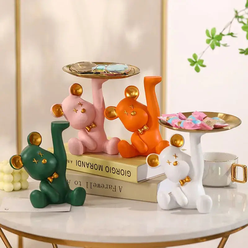 Set of four colorful resin bear house entry tray keys receivers with gold accents and x-shaped eyes for living room use