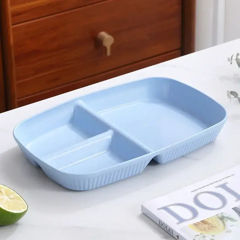 Light blue plastic divided dish diet plate with three compartments and ribbed edges for dining room use