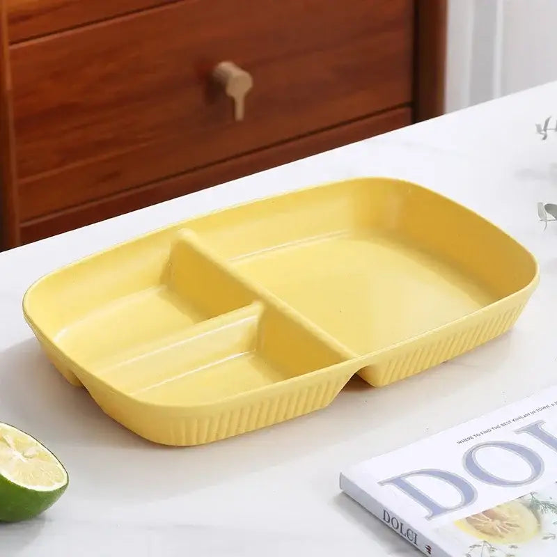 Bright yellow rectangular divided dish diet plate with three compartments and ribbed edges for dining room use