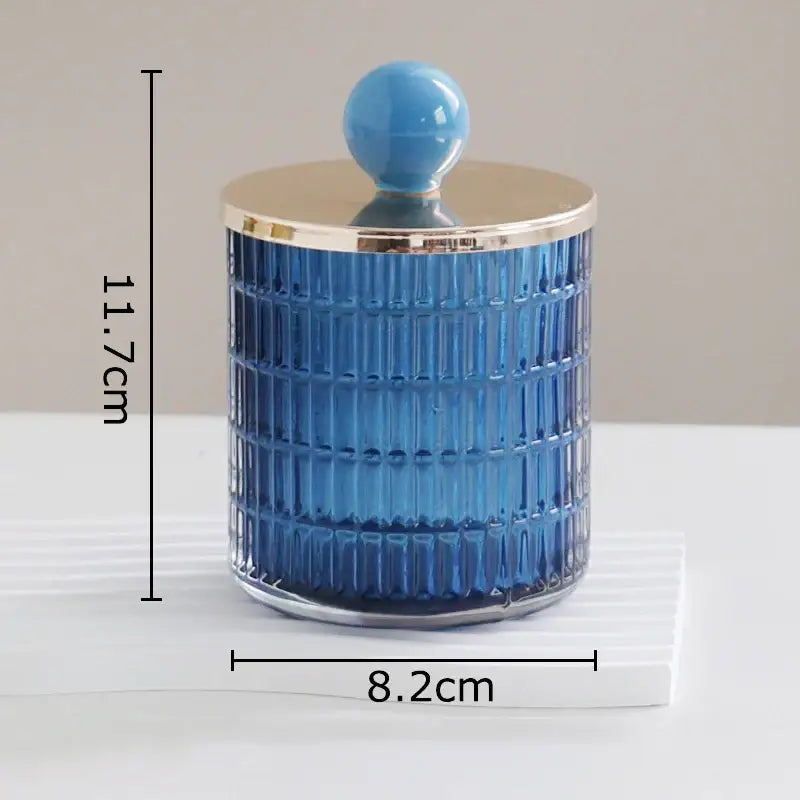 A blue ribbed glass tea canister with gold rim and lid from decorbites glass tea storage jar set