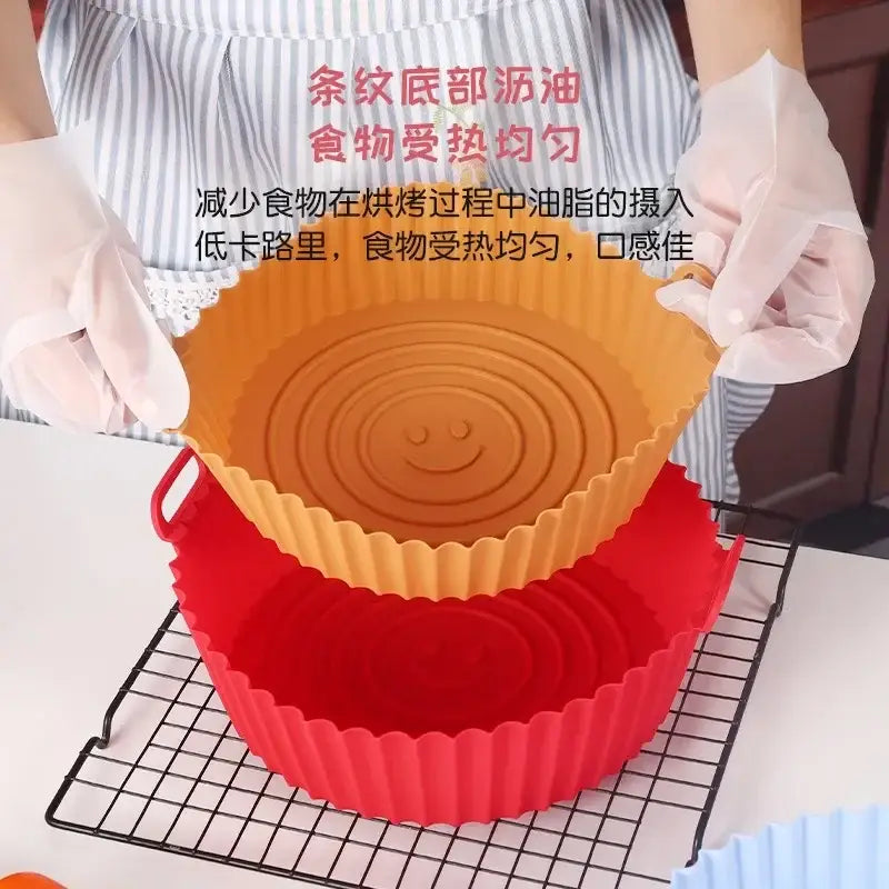Orange and red silicone basket trays with smiley face designs for baking grill pan use in kitchen set