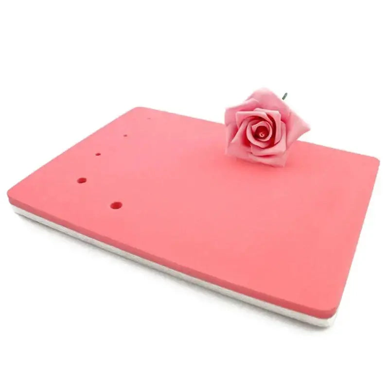 Pink foam cake shaping mat made of silicone with a delicate pink rose for kitchen fondant embossing use