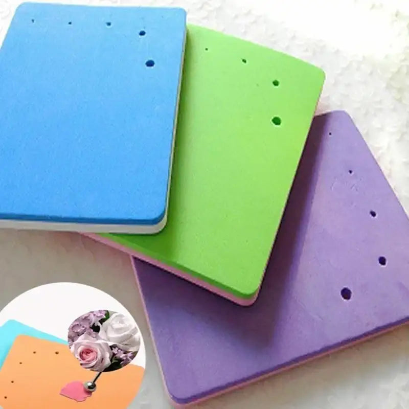 Colorful silicone foam cake shaping mat with evenly spaced holes for fondant embossing and decorative shaping use