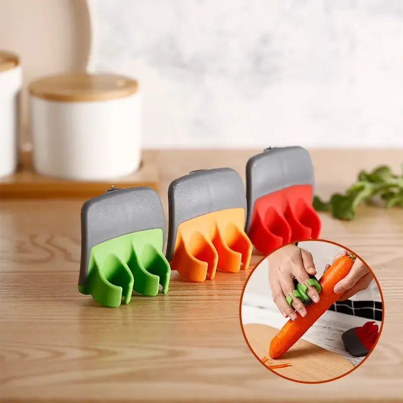 Set of three colorful silicone carrot fruit peeler slicers with gray plastic tops for easy vegetable preparation decorbites fruit peeler