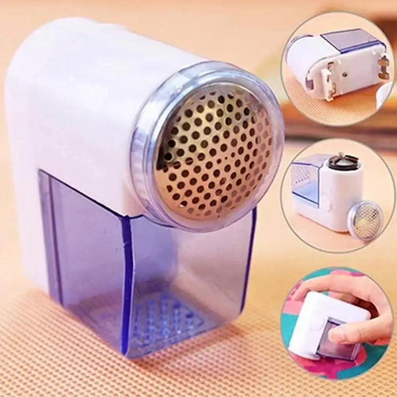 Compact blue and white electric fuzz pellet remover with metallic perforated head for fabric shaving and fuzz removal