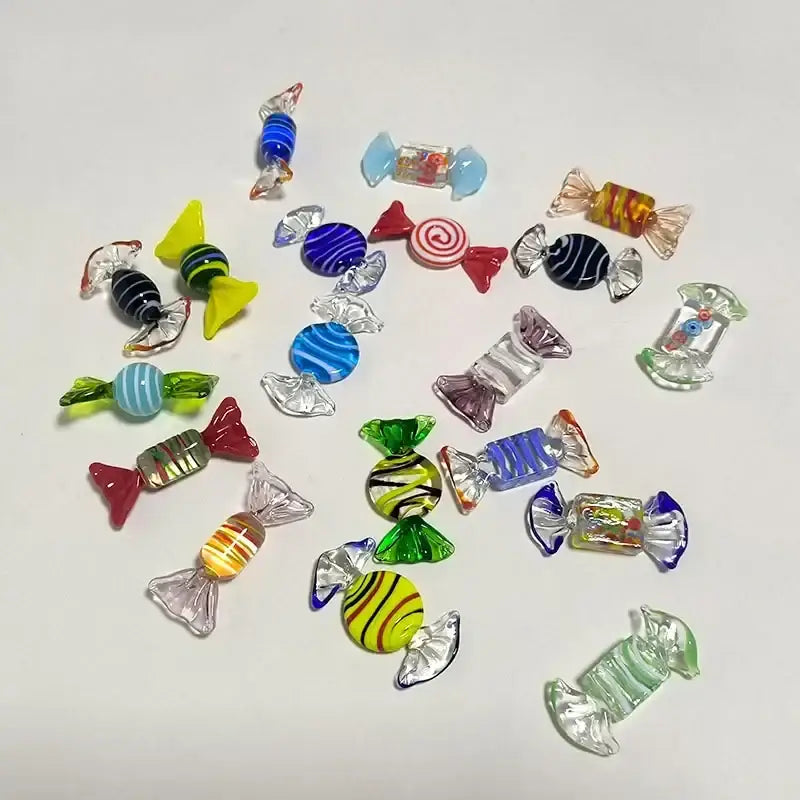 A decorbites conch candy jar with green and amber glass storage tray holding colorful translucent candy-shaped charms
