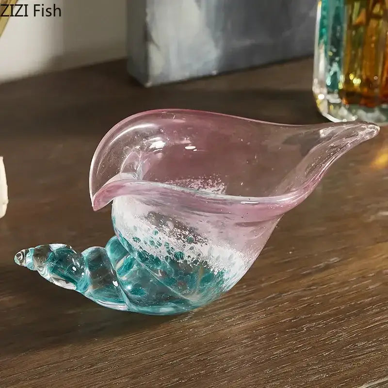 Translucent glass shell-shaped conch candy jar with pink rim and turquoise base featuring swirling patterns by decorbites conch