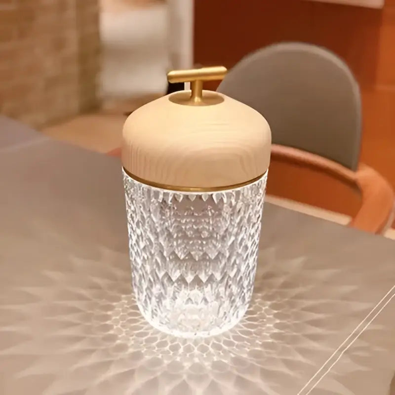 Clear glass jar with diamond-cut pattern and wooden lid with brass knob from decorbites conical crystal bedside lamp
