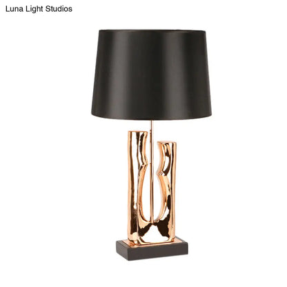 Contemporary 1-Head Black Barrel Fabric Table Light – Creative Desk Lamp for Bedroom