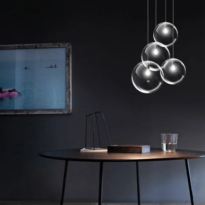 Contemporary 1-Light Black Orb Pendant: 6"/8"/12" Wide, Clear Glass, Ideal for Living Room Ceiling