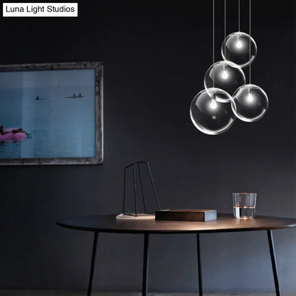 Contemporary 1-Light Black Orb Pendant: 6"/8"/12" Wide, Clear Glass, Ideal for Living Room Ceiling