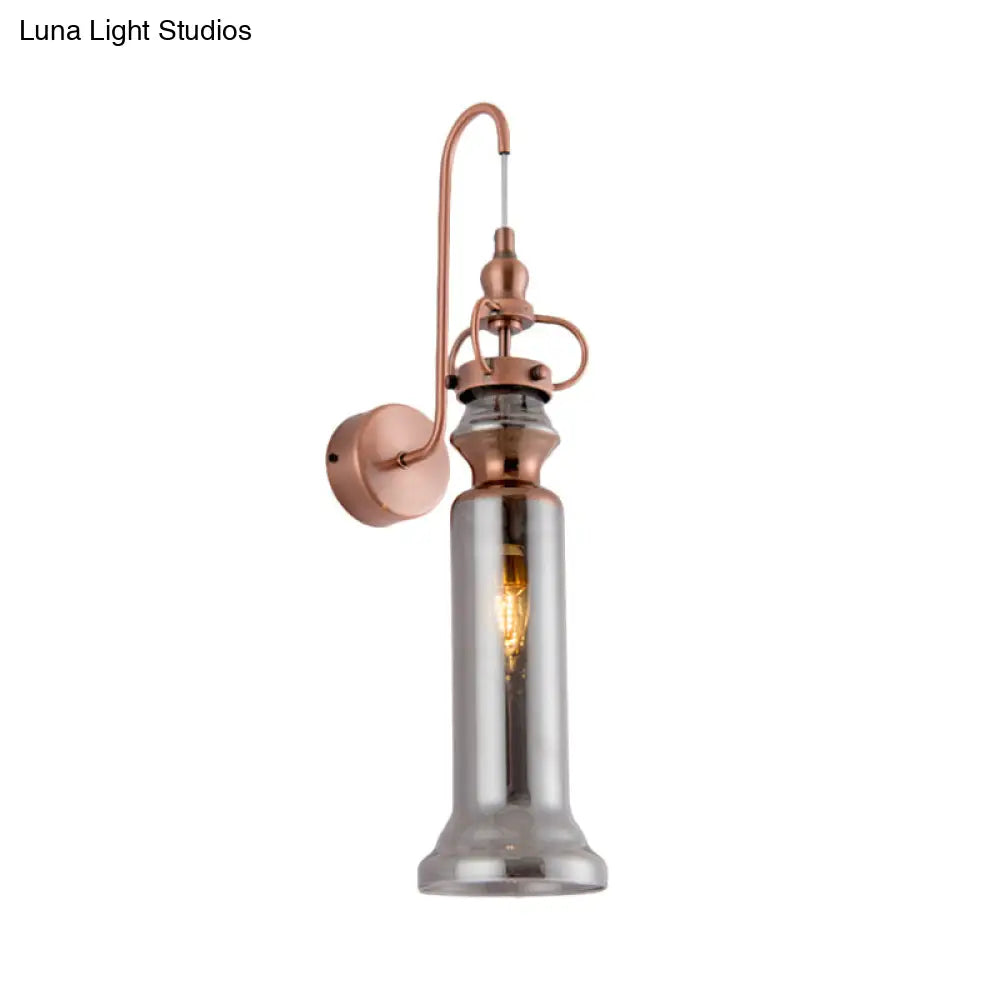 Aplique de pared DecorBites™ contemporáneo de 2 luces con acabado en cobre, tubo de cristal gris humo/ámbar y brazo flexible