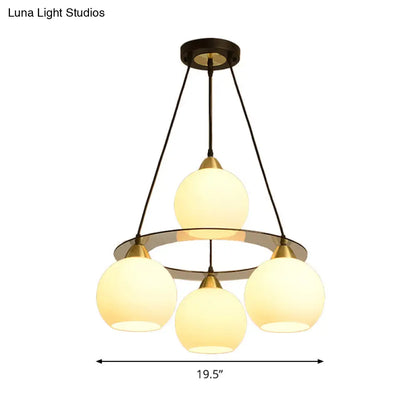 Lámpara de araña contemporánea de 4 luces en negro y dorado con pantalla de cristal opalino